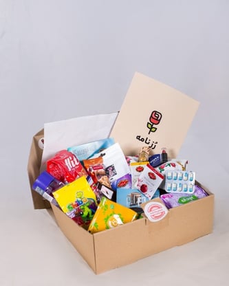 a box full of products and a personalized card
