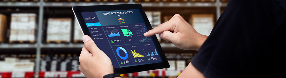 there is a warehouse management dashboard on an ipad screen that someone is holding