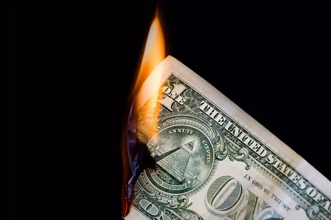money dollar fire burning